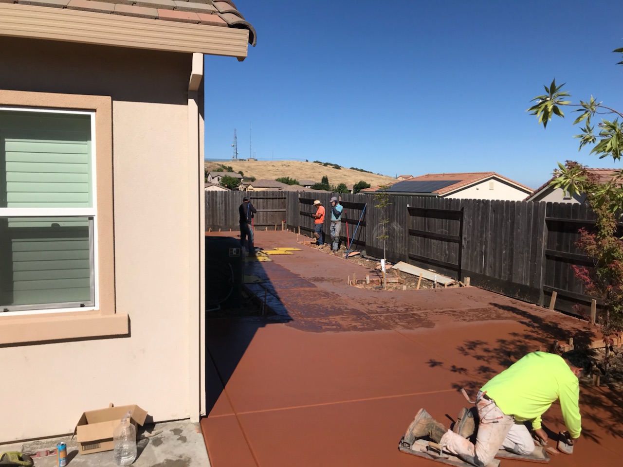 The photo shows the finished colored concrete work in Chino Hills.